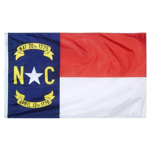 red white and blue flag with two dated scrolls and the letters "N C"