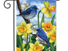 blue birds sitting on a tree with yellow daffodils flag