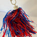 red and blue pom pom with a handle saying "go bills"