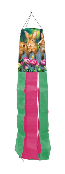 bunnies on a fence windsock with alternating pink and green windsock tails