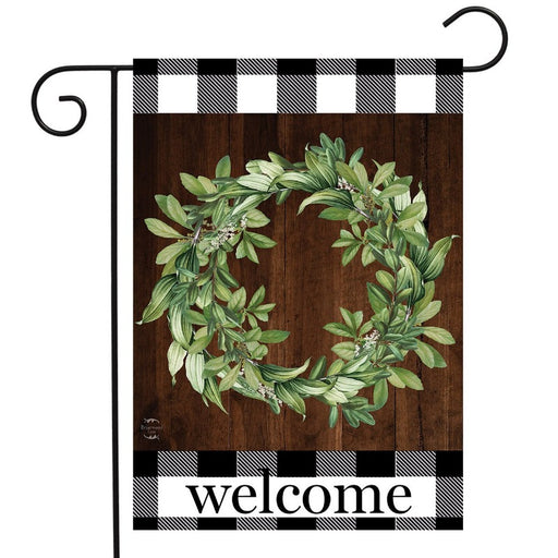brown flag gingham print on the edges and a wreath that says "welcome"