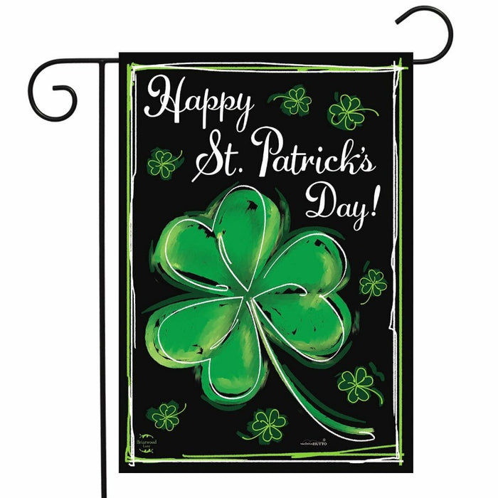 black background flag with a shamrock and the words "happy St. Patrick's day"
