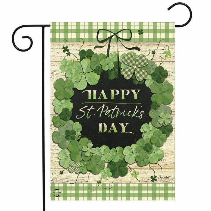 shamrocks in a wreath pattern and text saying "happy st.patrick's day"