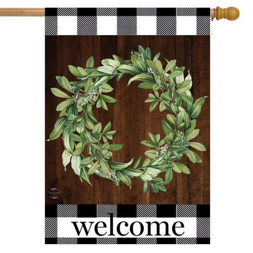 brown flag gingham print on the edges and a wreath that says "welcome"