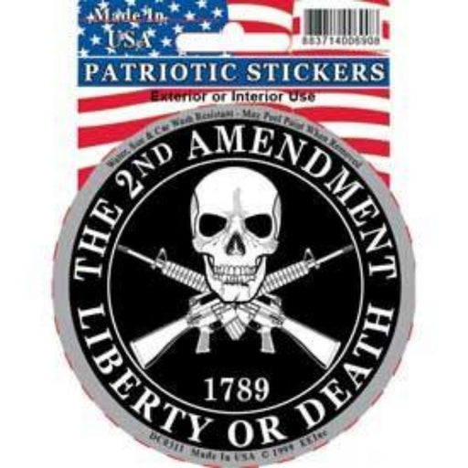 CIRCLE STICKER WITH A SKULL DESIGN AND GUNS BEHIND IT WITH HOLOGRAPHIC EDGES AND TEXT SAYING "THE 2ND AMENDMENT LIBERTY OR DEATH"