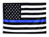 BLACK AND WHITE AMERICAN FLAG WITH A BLUE STRIPE IN THE CENTER