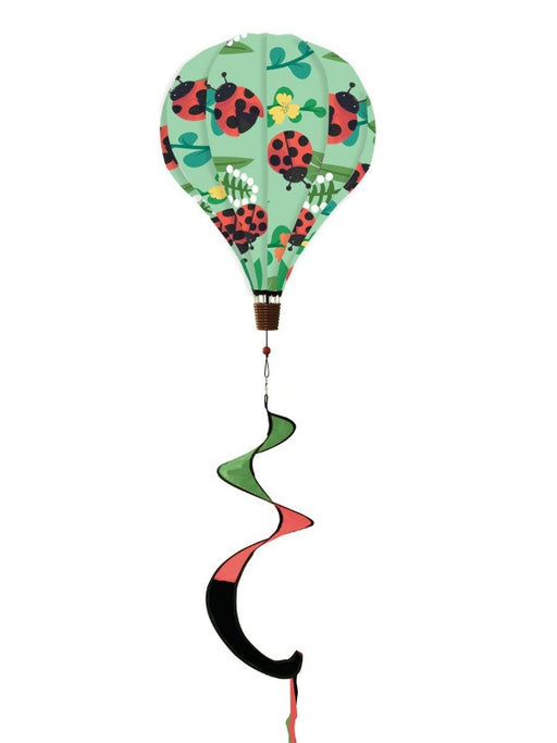 green wind balloon with ladybugs and red and green tail